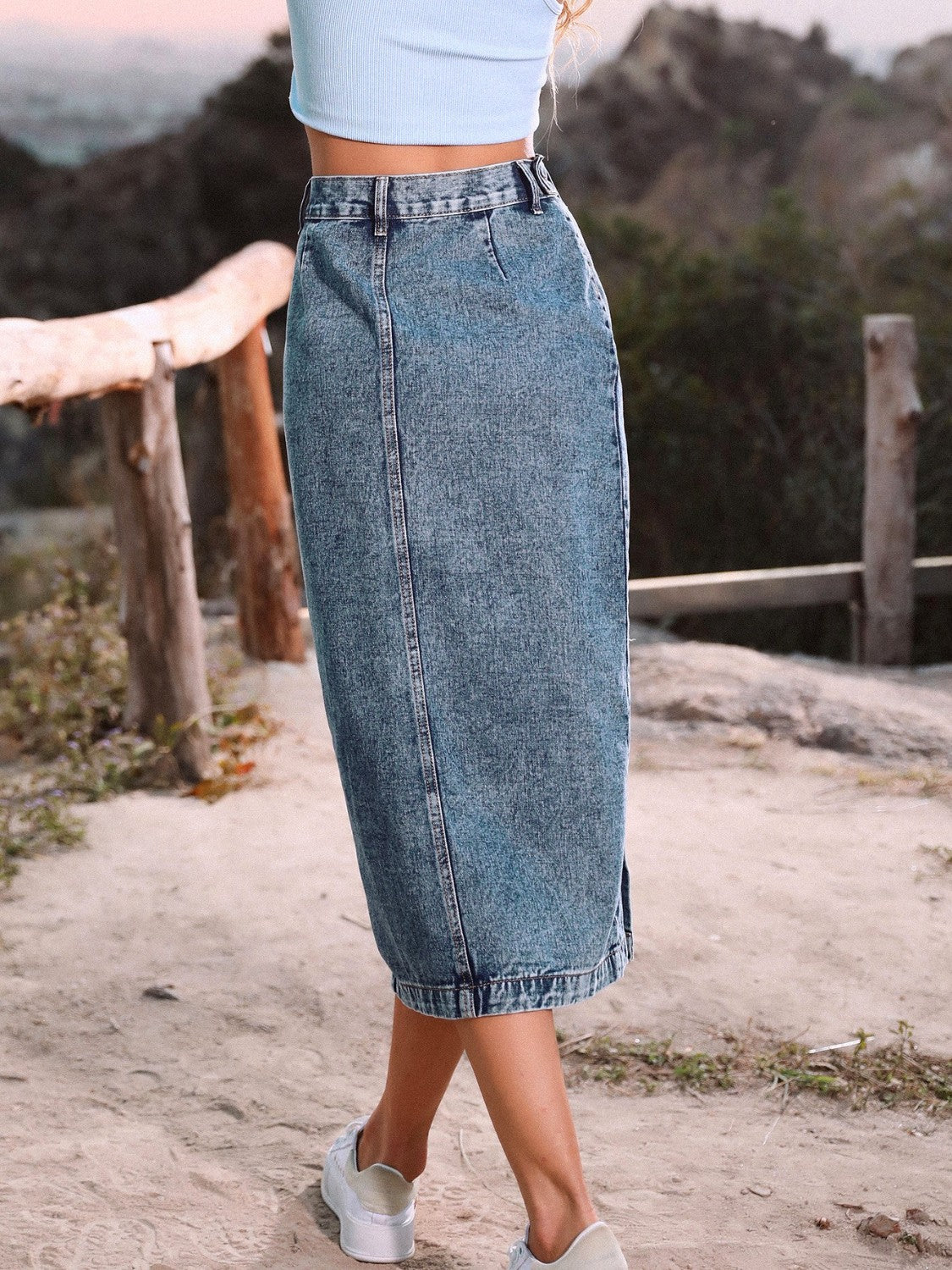 Button-front denim midi skirt in Sky Blue with a straight cut and visible stitching.