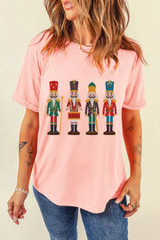 Blush pink t-shirt with a graphic print of four nutcracker soldiers in uniform.