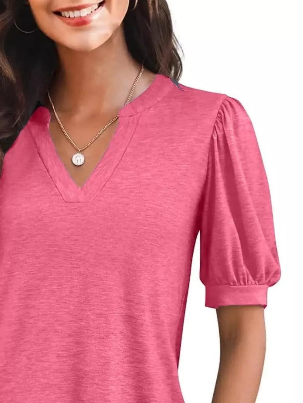 Puff sleeve notched V-neck t-shirt in Rose Pink with a textured knit fabric.
