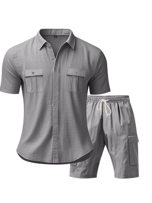 Grey relaxed-fit button-up shirt with two chest pockets and drawstring shorts.