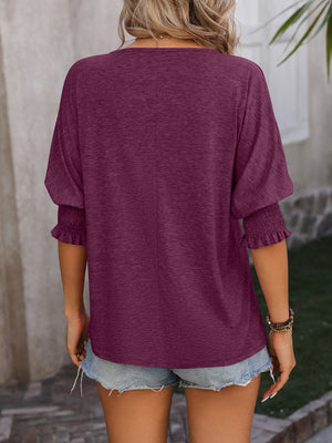 Deep purple blouse with shirred sleeve detail and keyhole neckline, casual fit.