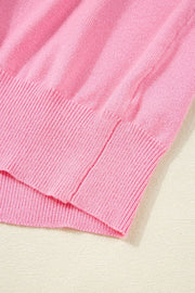 Pink knit blouse with ribbed hem detail