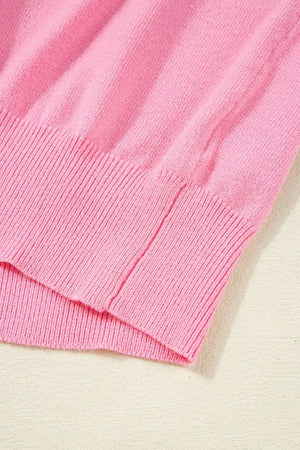 Pink knit blouse with ribbed hem detail