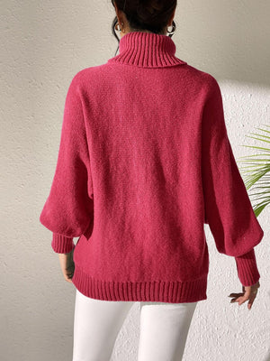 Deep Red knit turtleneck sweater with balloon sleeves and ribbed cuffs and hem.