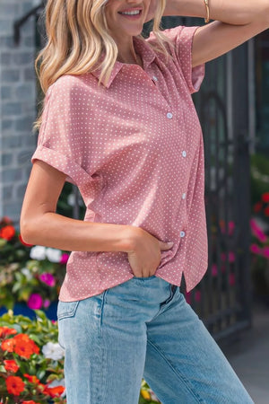 Polka dot print casual button-up shirt in pink polyester with short sleeves and a collared neckline.