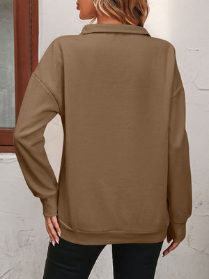 Camel quarter-zip relaxed fit sweatshirt with collar and long sleeves.