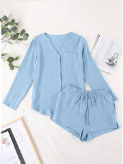 Light blue textured cotton pajama set with button-up top and drawstring shorts