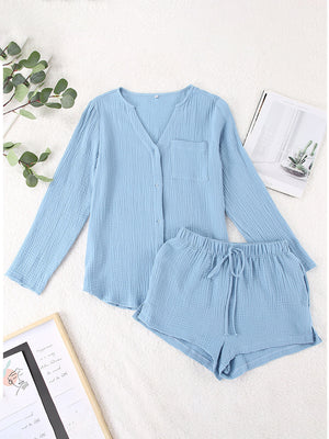Light blue textured cotton pajama set with button-up top and drawstring shorts