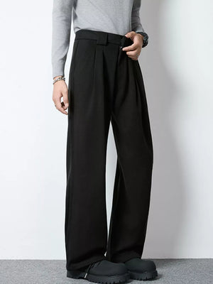 Men's black wide-leg pleated dress pants with a relaxed fit.