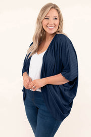 Dark blue ribbed batwing cardigan with drape front and elbow-length sleeves.