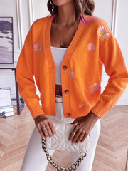 Tangerine button-down cardigan with embroidered daisies and ribbed cuffs.