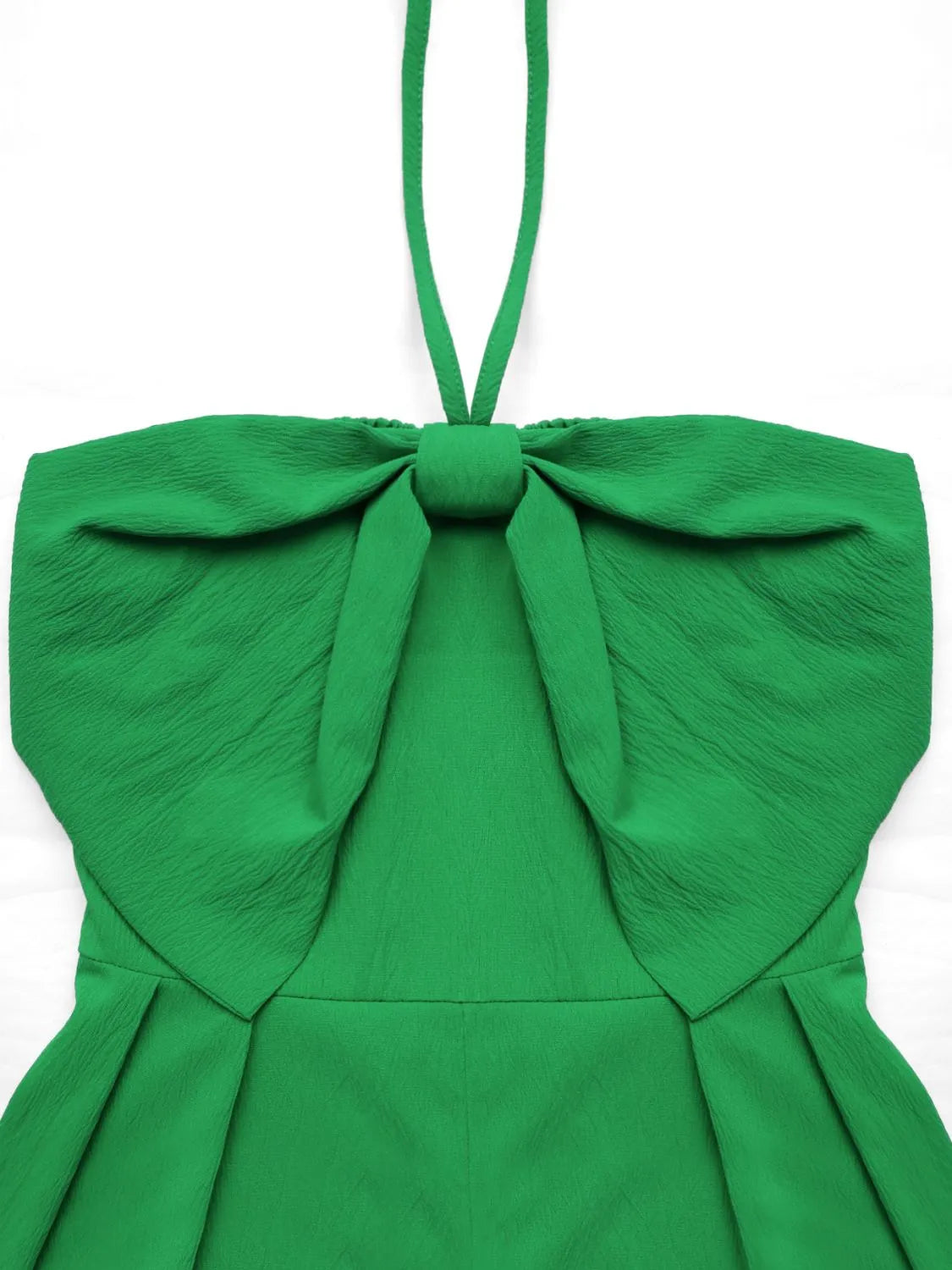 Green halterneck romper with large bow detail and smocked back.