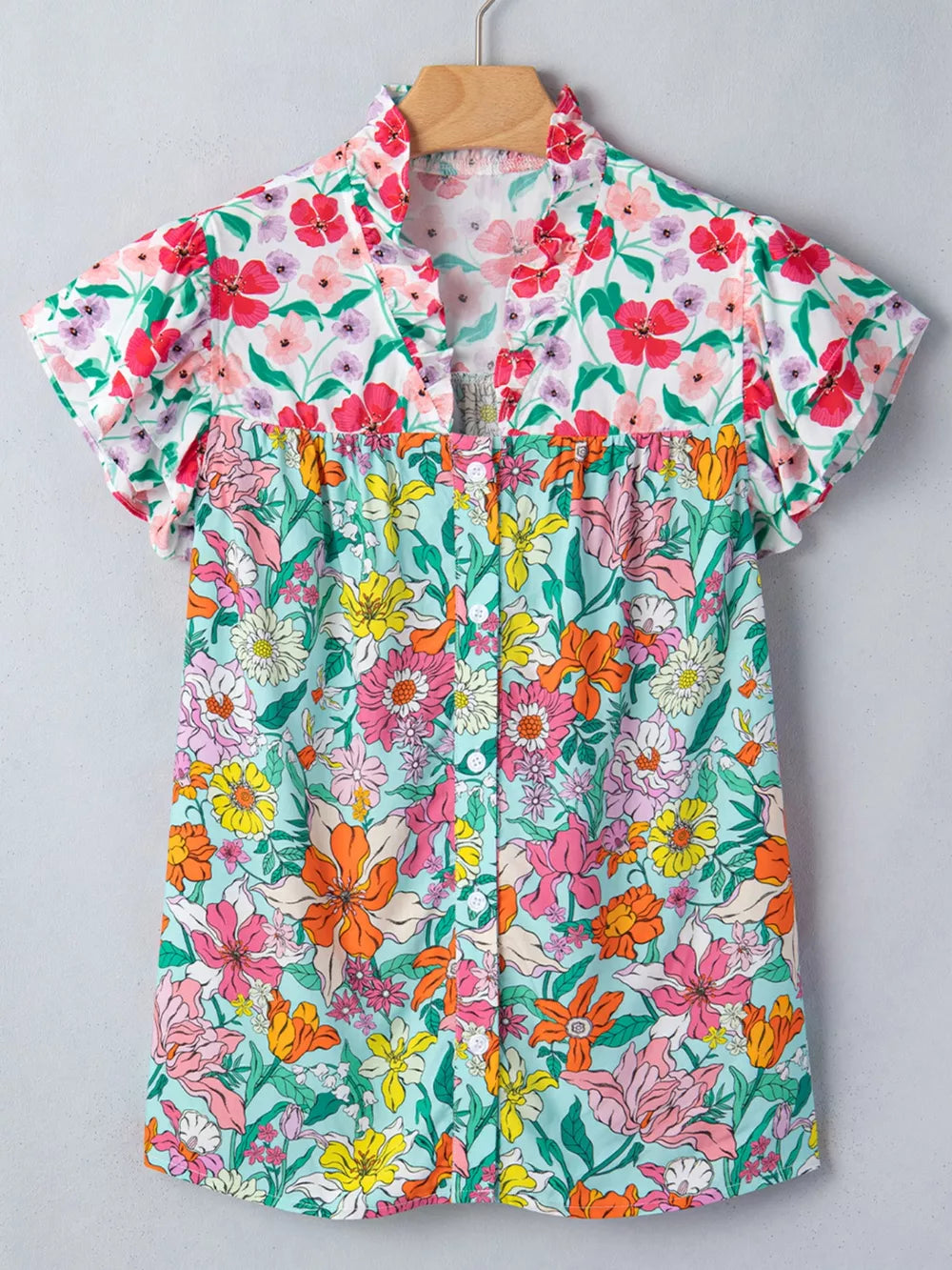 Maternity floral print overshirt with flutter sleeves and ruffled collar.