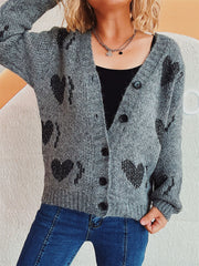 Dark gray knit cardigan with black heart motif, V-neck, button front, and long sleeves.