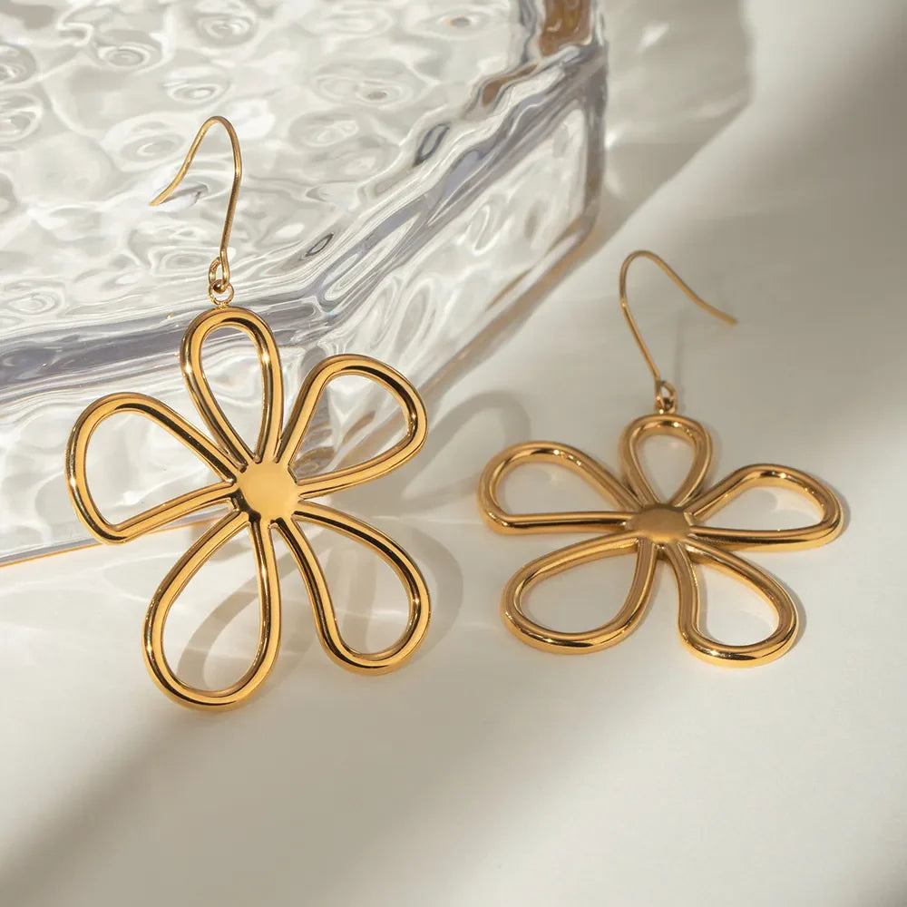 Gold sculpted petal drop earrings with a flower design, 18K gold-plated.