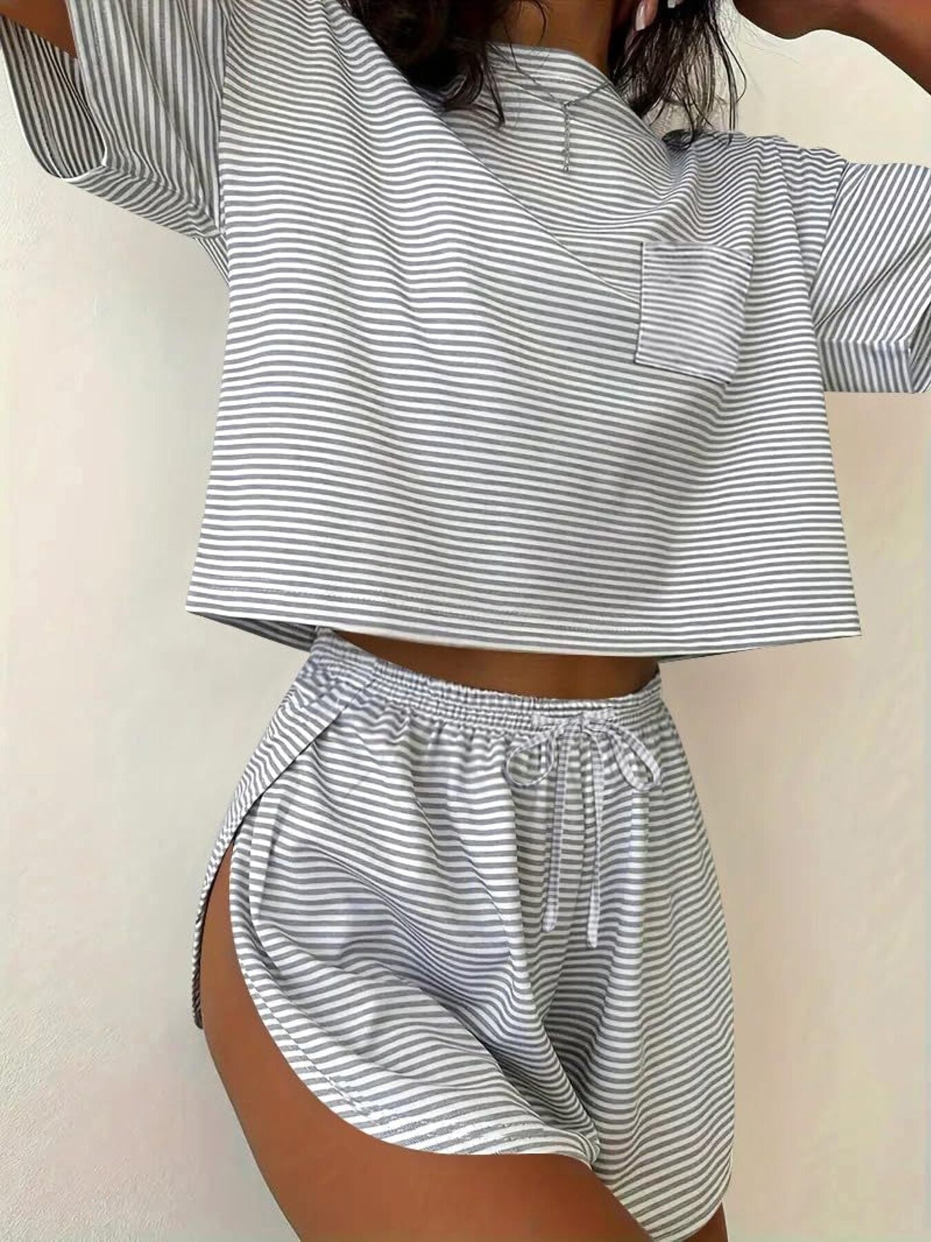Gray striped pajama set with cropped top and drawstring shorts