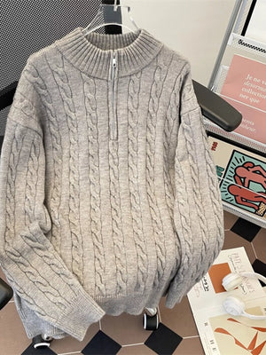 Men's gray cable knit quarter zip sweater with mock neck