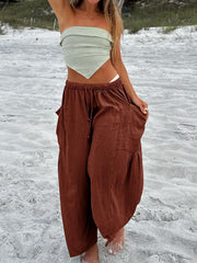Linen balloon trousers in dark brown with cargo pockets and drawstring waist