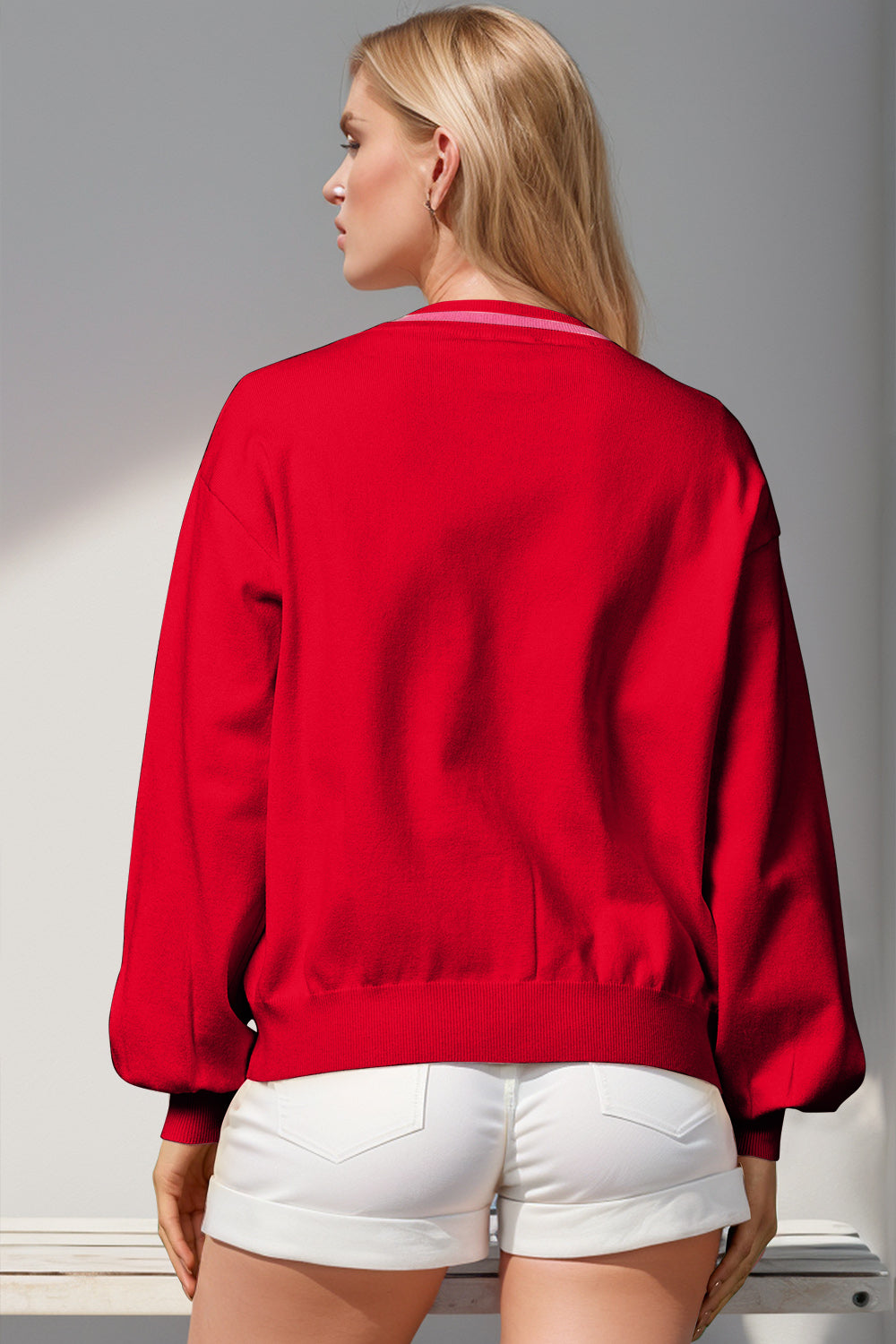 Red acrylic cardigan with striped neckline and balloon sleeves