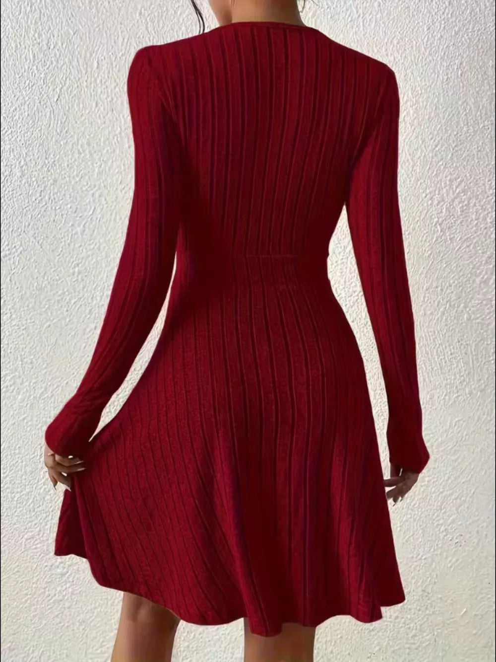 Burgundy ribbed wrap mini dress with long sleeves and an a-line skirt.