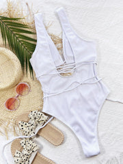 White ribbed cut-out one-piece swimsuit with plunge neckline and wrap detail