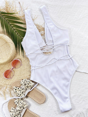 White ribbed cut-out one-piece swimsuit with plunge neckline and wrap detail