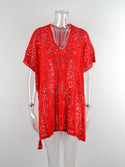 Red open-knit V-neck beach cover-up with short sleeves and tassel detail.