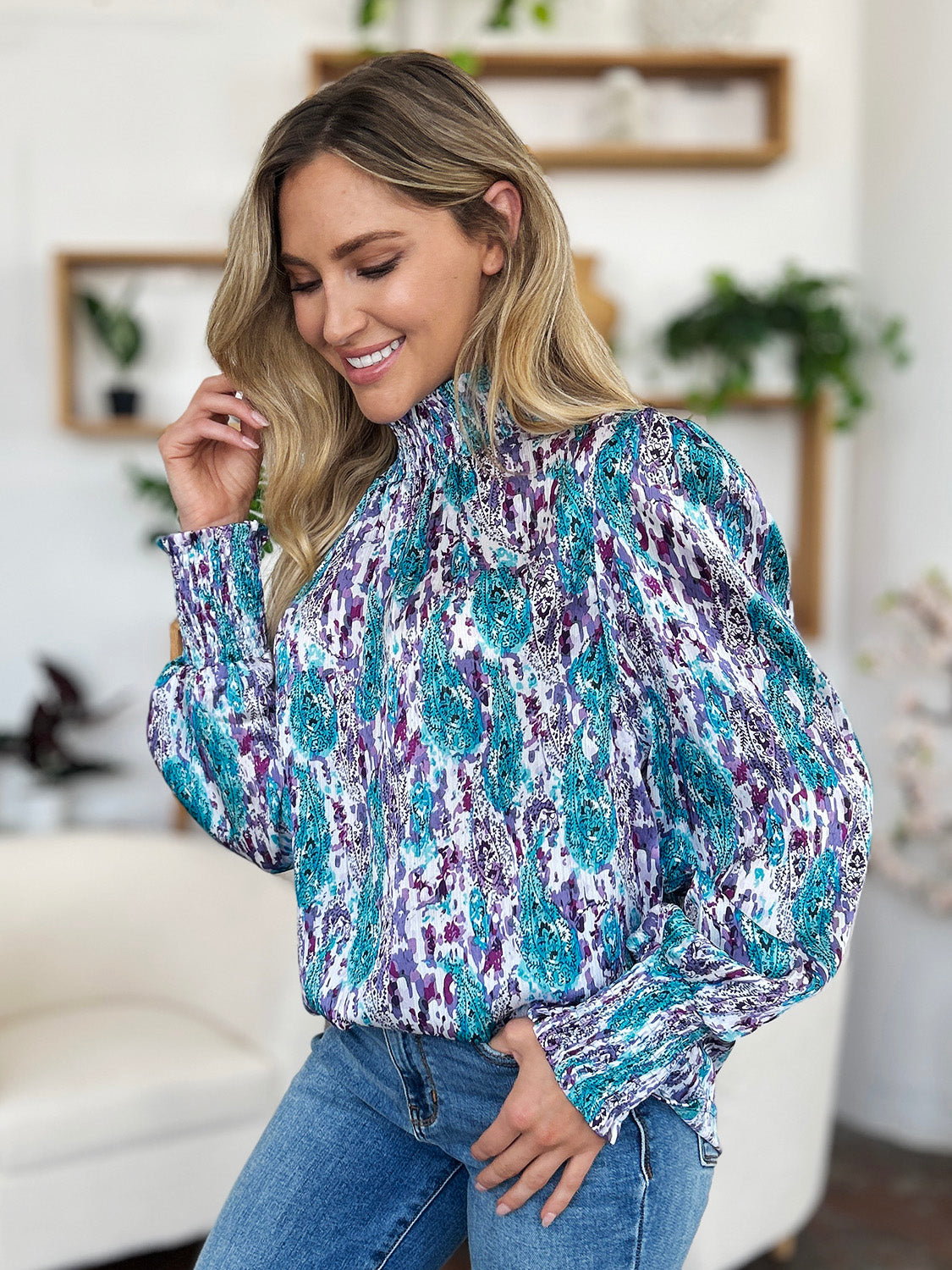 High neck abstract print blouse in sky blue and violet with smocked cuffs.