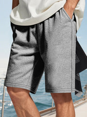 Men's heather gray drawstring casual shorts with side pockets.