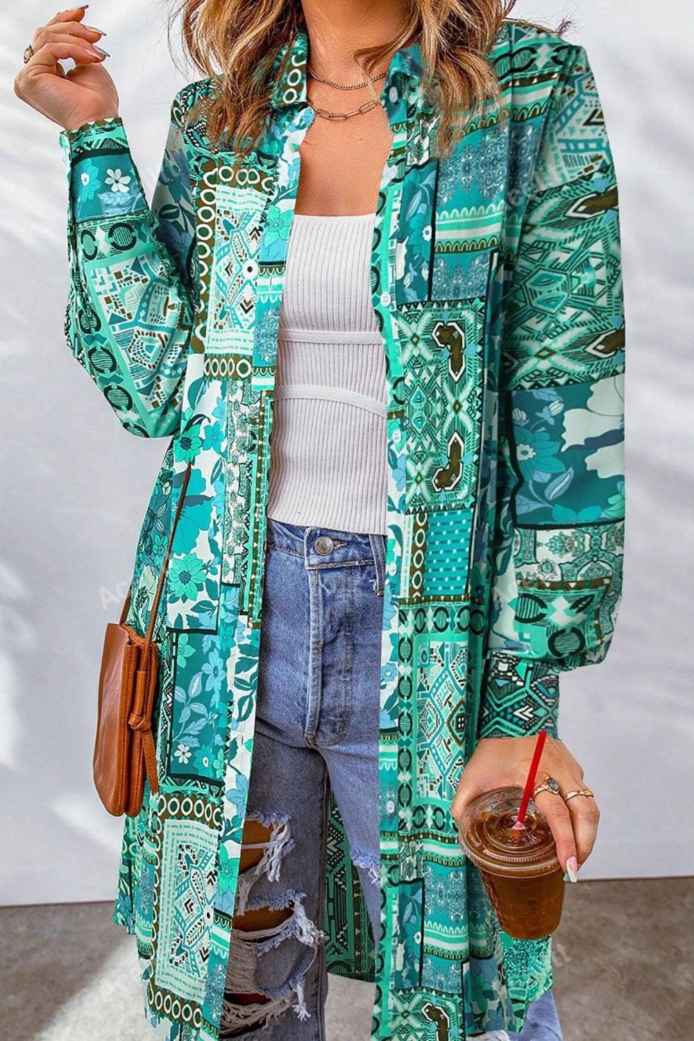 Patchwork print duster shirt jacket in turquoise with button front and long sleeves.