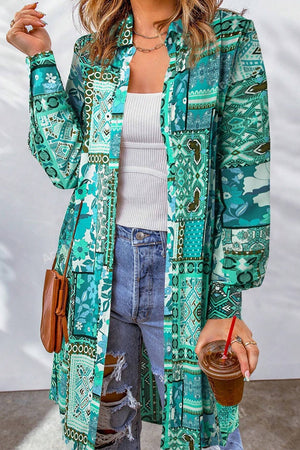 Patchwork print duster shirt jacket in turquoise with button front and long sleeves.