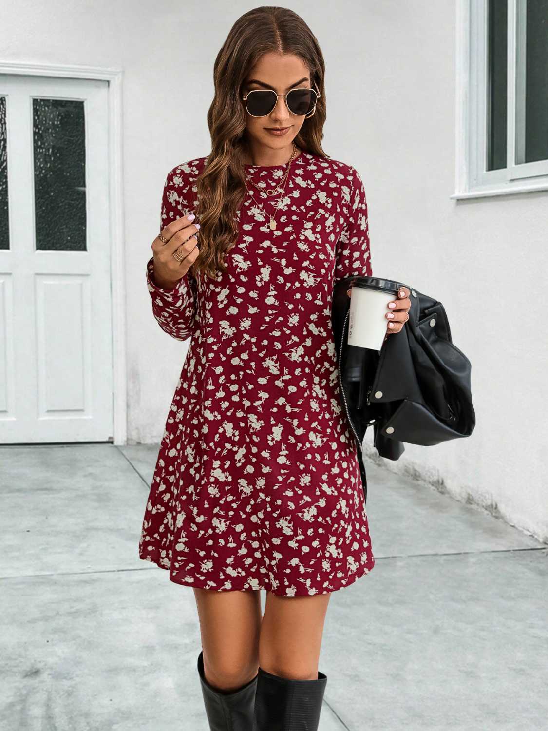 Deep red floral swing mini dress with long sleeves and round neckline.