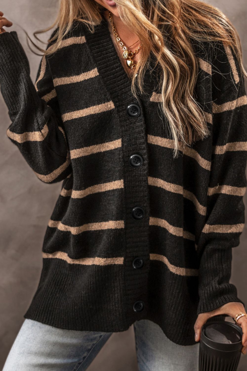 Chunky stripe button-down cardigan in black and beige acrylic with a V-neck and button closure.