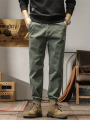 Men's plus size slim fit ankle pants in military green with a tapered leg and cuffed hem.