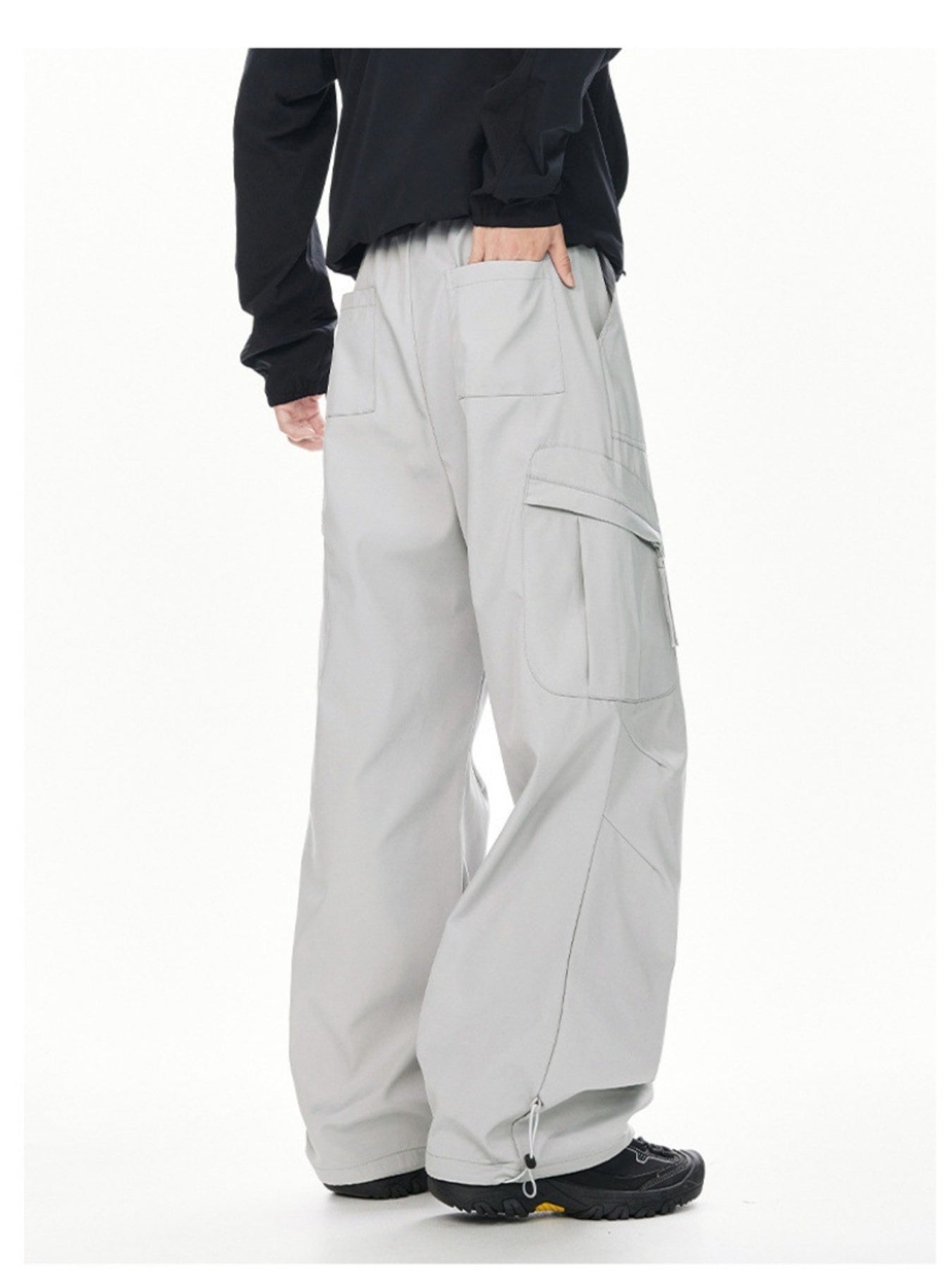 Men's light gray relaxed fit cargo sweatpants with adjustable drawstring cuffs.