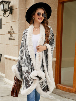 Feather print cape with faux fur trim in charcoal and ivory, acrylic fabric