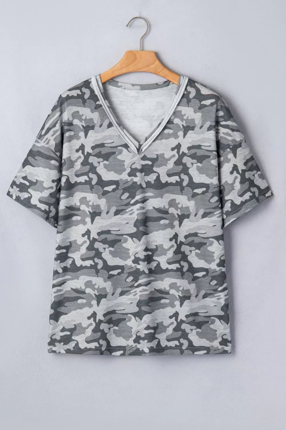 Camouflage v-neck relaxed tee with short sleeves and a grey camo print.