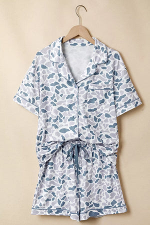 Blue camouflage print button-down pajama set with short sleeves and drawstring shorts.