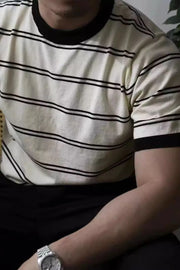 Beige ribbed stripe t-shirt with black contrast trim neckline and cuffs