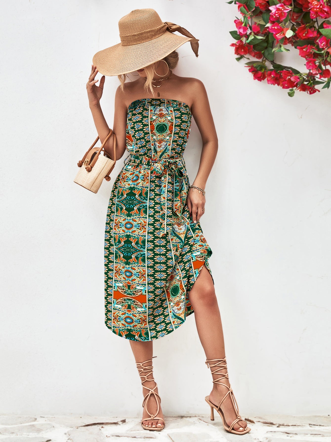 Green printed bandeau midi dress with asymmetric hem and belt.