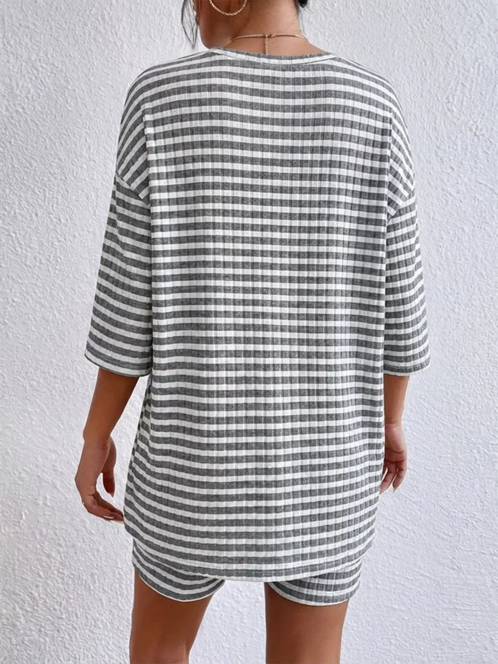 Gray striped two-piece set with elbow sleeve top and shorts.