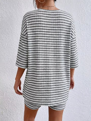 Gray striped two-piece set with elbow sleeve top and shorts.