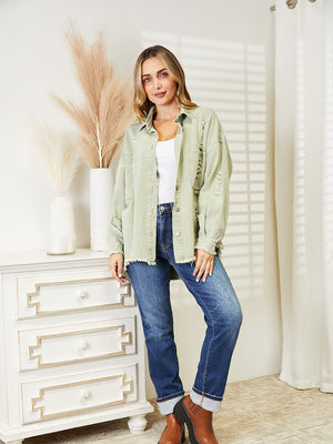 Light green distressed denim overshirt with raw hem and button front.