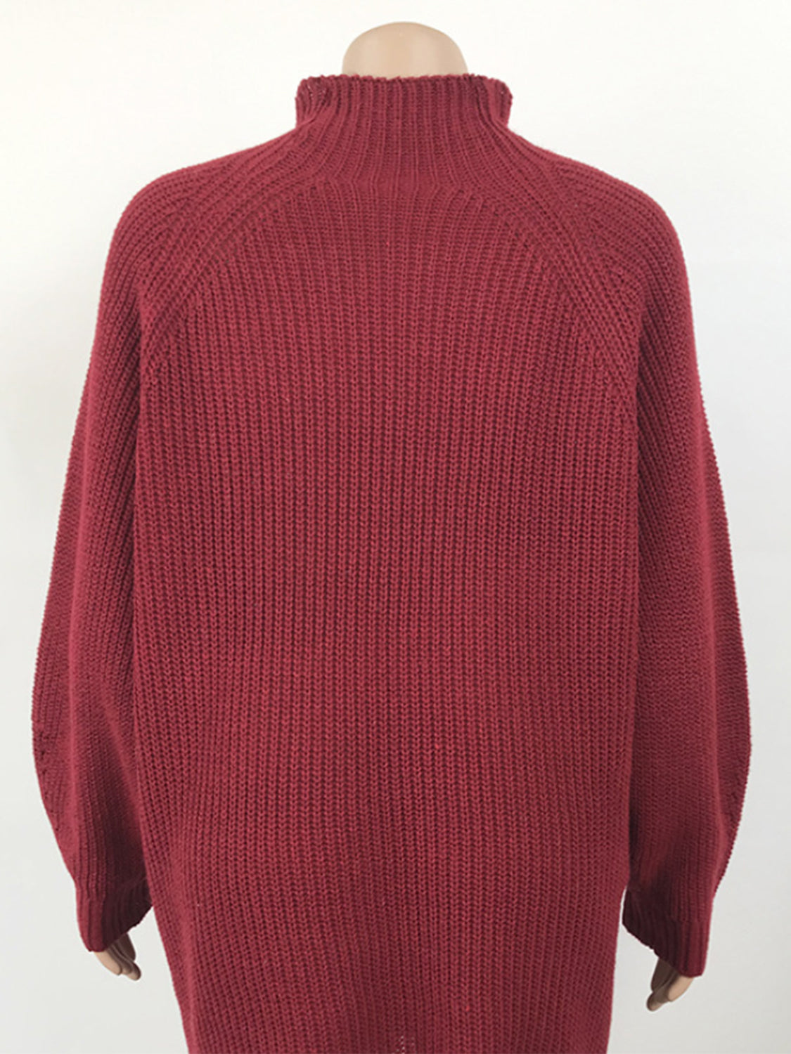 Deep Red ribbed knit cocoon turtleneck dress with raglan sleeves.