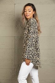 Black abstract spot print oversized shirt with buttoned cuffs and a collared neckline.