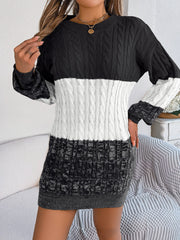 Colorblock cable knit mini dress with crew neck and long sleeves in black, white, and grey.