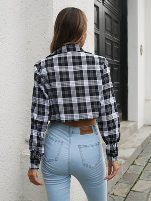 Black and white plaid cropped shirt jacket with buttoned front and collar.