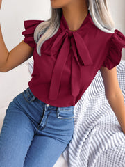 Burgundy ruffled sleeve pussybow blouse with tie detail.