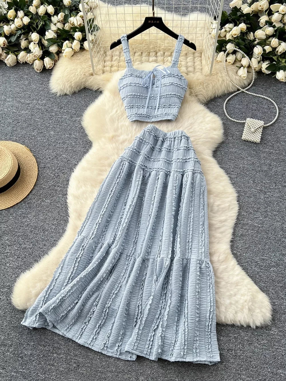 Blue gray ruched crop top and maxi skirt set with tie front and tiered skirt.