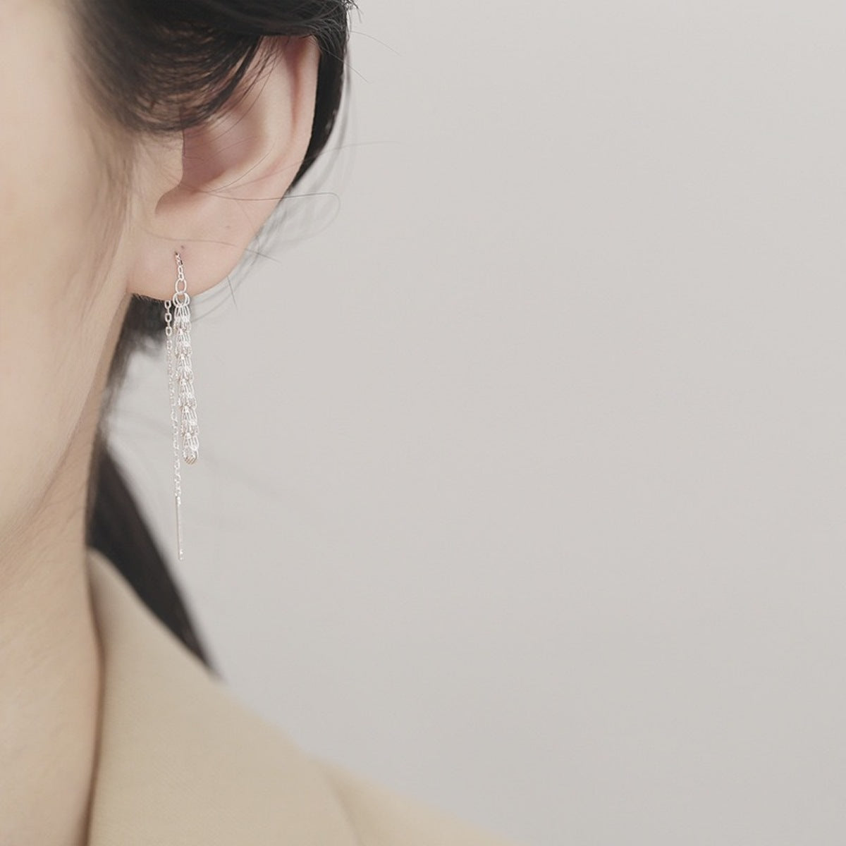 Elegant sterling silver threader earrings with delicate chain tassels.